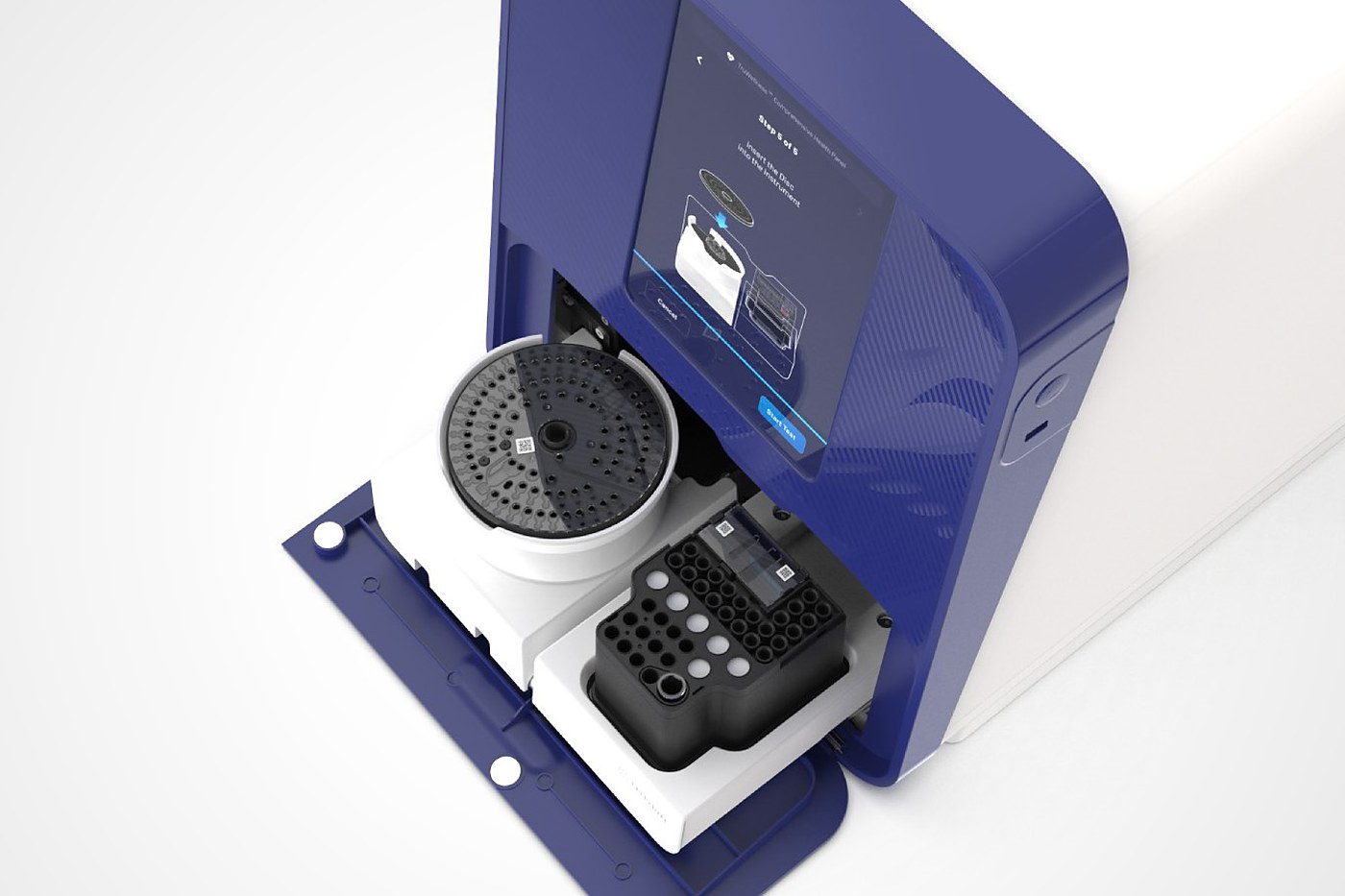 A benchtop analyser with its drawer open and a cartridge ready to insert